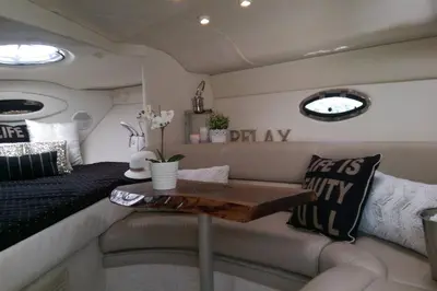 a living room with a bed and a table at Bobs Yer Uncle in Port Dalhousie in St. Catharines