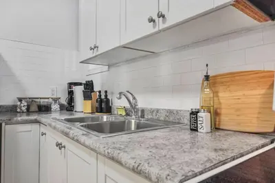 a kitchen with a sink and a counter top at 2 BR 1 Bath Apt with Parking and Close to all Amenities in Oshawa