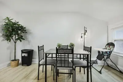 a dining room with a table and chairs at 2 BR 1 Bath Apt with Parking and Close to all Amenities in Oshawa