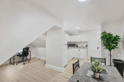 an open kitchen and dining room with a table and chairs at 2 BR 1 Bath Apt with Parking and Close to all Amenities in Oshawa