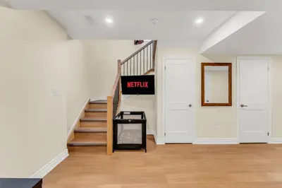 a hallway with stairs and a sign that readsweekly at Sunshine Villa Closest BNB to Falls Hot Tub Oasis in Niagara Falls