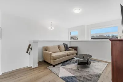 a living room with a couch and a table at Luxury New Home By Niagara Fall in Fonthill