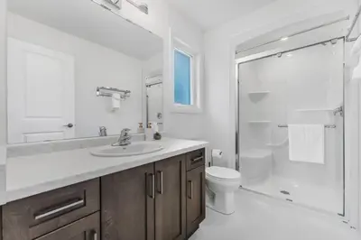a bathroom with a sink and a shower and a toilet at Luxury New Home By Niagara Fall in Fonthill