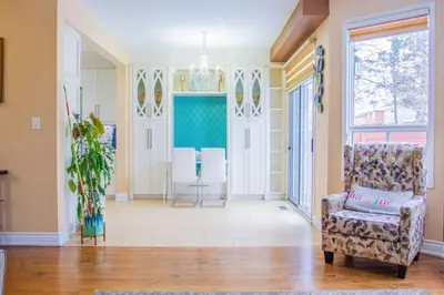 a living room with a couch and a chair at Royal Luxury Central Home with Gazebo By Toronto in Brampton