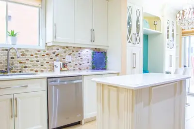 a kitchen with white cabinets and a white counter top at Royal Luxury Central Home with Gazebo By Toronto in Brampton