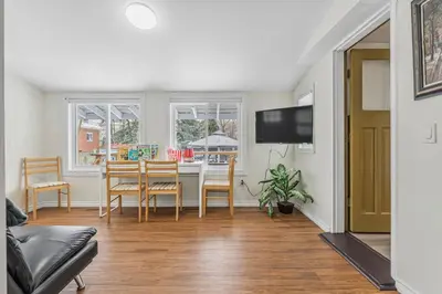 a living room with a table and a dining room at Cozy Home Short Walk to Falls Nintendo FirePit in Niagara Falls