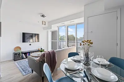 a dining room with a glass table and chairs at Scarborough Oasis near UofT campus, Free Parking in Toronto