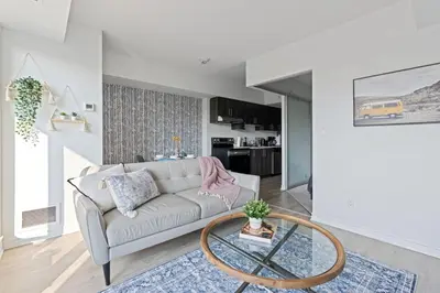 a living room with a couch and a table at Scarborough Oasis near UofT campus, Free Parking in Toronto