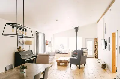 a living room with a table and a couch at Wellington Waterfront Home in Wellington