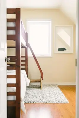 a room with a bunk bed and a window at Wellington Waterfront Home in Wellington