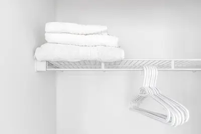 a stack of towels on a towel rack in a bathroom at Toronto Downtown Elite Residence - Available for Christmas in Toronto