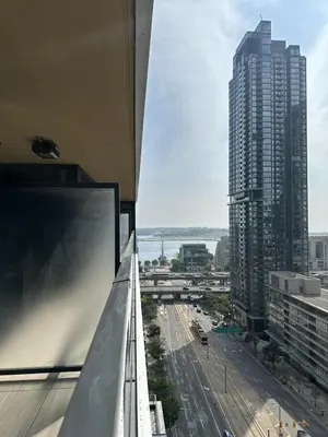 a view of a city skyline from a building at Entire Luxe Condo in Downtown Toronto in Toronto