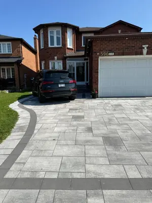 a driveway with a car parked in front of a house at VP1 master bedroom on second floor in Mississauga