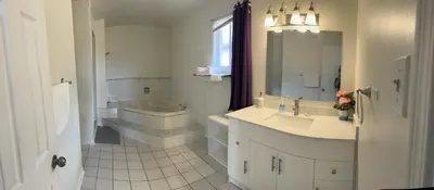 a bathroom with a sink and a toilet and a tub at VP1 master bedroom on second floor in Mississauga
