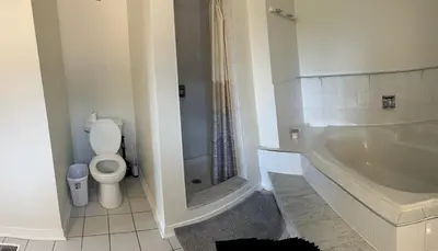 a bathroom with a tub and a toilet and a sink at VP1 master bedroom on second floor in Mississauga
