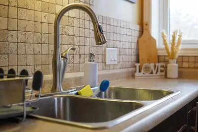 a kitchen sink with a faucet in a kitchen at Lake-Access Cottage- Hot Tub, Fireplace&Pool Table in Bewdley