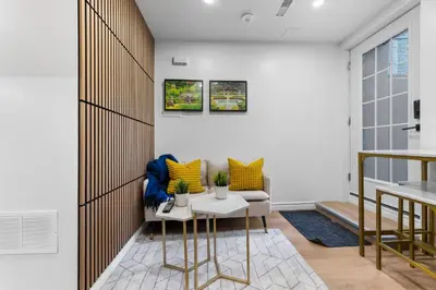 a living room with a couch and a table at High Park Grove Modern 1B1B, Kitchen, Laundry in Toronto
