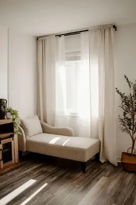 a living room with a couch and a window at Barrie Hideaway in Barrie