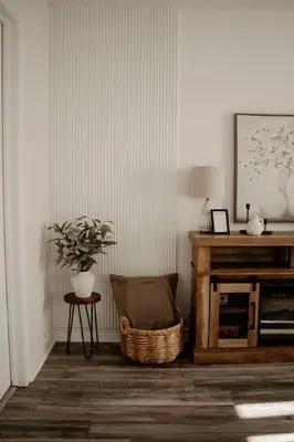 a living room with a table and a plant in it at Barrie Hideaway in Barrie