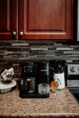 a kitchen counter with a microwave and a coffee maker at Barrie Hideaway in Barrie