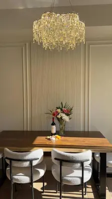 a dining room table with chairs and a chandelier at Barrie Hideaway in Barrie
