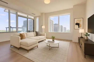 a living room with a couch and a tv at Paradise - 2 Bedroom modern, cozy and luxury living in Mississauga