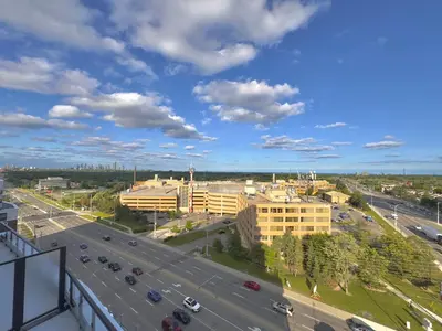 an aerial view of a city with a highway at Paradise - 2 Bedroom modern, cozy and luxury living in Mississauga