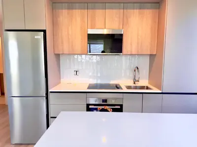 a kitchen with a stainless steel refrigerator and a sink at Paradise - 2 Bedroom modern, cozy and luxury living in Mississauga