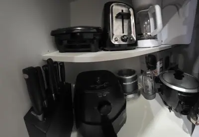 a kitchen counter with a coffee maker on a shelf at Togather Time,5 minutes to HYW 401 in Oshawa