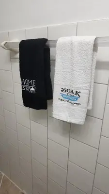 two towels hanging on a towel rack in a bathroom at Togather Time,5 minutes to HYW 401 in Oshawa
