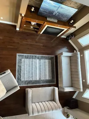 a living room with a couch and a window at 3300 SqFt - Modern and Comfort - 3 BDRM Getaway - Relax - Unwind - Explore - Near Toronto Pearson Airport & Toronto Downtown in Brampton
