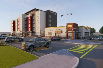 a rendering of a parking lot with cars parked at TownePlace Suites by Marriott Woodstock in Woodstock