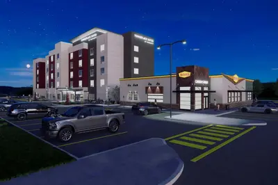 a rendering of a parking lot with cars parked at TownePlace Suites by Marriott Woodstock in Woodstock