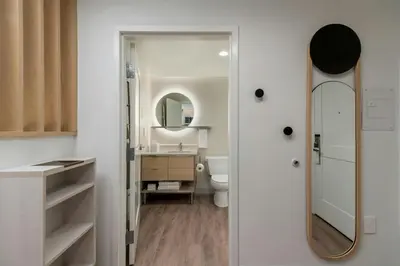 a bathroom with a sink and a mirror at TownePlace Suites by Marriott Woodstock in Woodstock