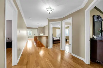 a living room with a staircase and a bedroom at Luxury Mansion by Toronto and YYZ with Large Backyard Weddings in Brampton