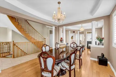 a dining room with a table and chairs at Luxury Mansion by Toronto and YYZ with Large Backyard Weddings in Brampton