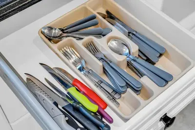 a tray filled with utensils in a drawer at Bright 6BR Near Niagara Falls with BBQ Yard in Thorold