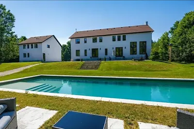 a house and a swimming pool in front of a house at Luxury Countryside Villa in Waterford