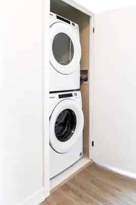 a laundry room with a washer and dryer at Spacious 3-Bedroom SkyLoft with Beautiful City Views and Parking in Toronto
