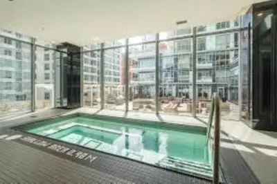a swimming pool in the middle of a building at Cozy Condo Midtown Toronto in Toronto