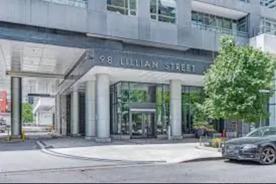 a car parked in front of a building at Cozy Condo Midtown Toronto in Toronto