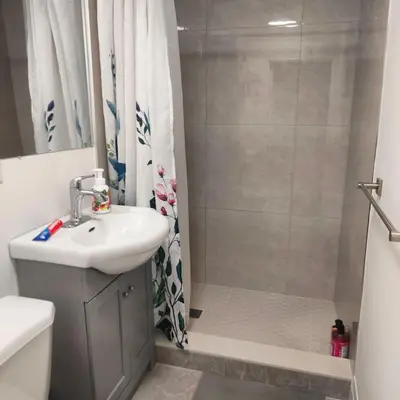 a bathroom with a sink and a shower at Bloor&Beyond- Free Wifi-Next to Subway Union Line in Toronto