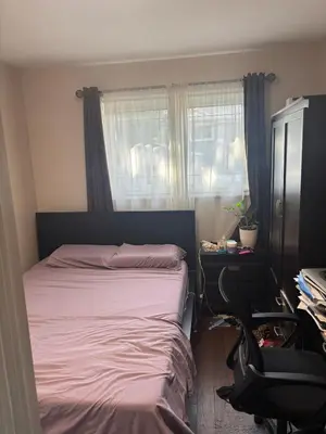 a bedroom with a bed and a desk and a chair at Home in Scarborough, near GO station, TTC and UoT in Toronto