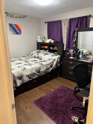 a bedroom with a bed and a desk and a chair at Home in Scarborough, near GO station, TTC and UoT in Toronto