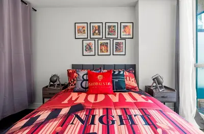 a bedroom with a bed with a colorful bedspread at 1 Bedroom Condo with Balcony Fort York Downtown Toronto in Toronto