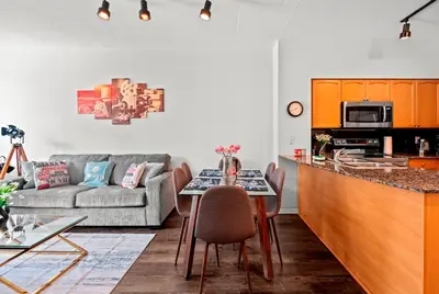 a kitchen and living room with a couch and a table at 1 Bedroom Condo with Balcony Fort York Downtown Toronto in Toronto