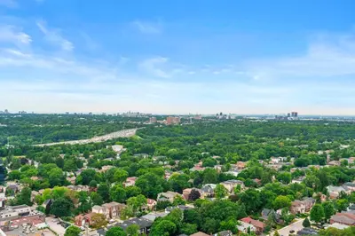 an aerial view of a city with trees and buildings at High Floor 1 Bedroom plus Den Condo Apartment City View North York Toronto in Toronto