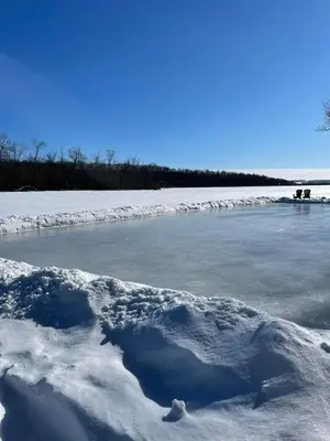 a body of water with snow on it at Winter at Wildwood in Bailieboro
