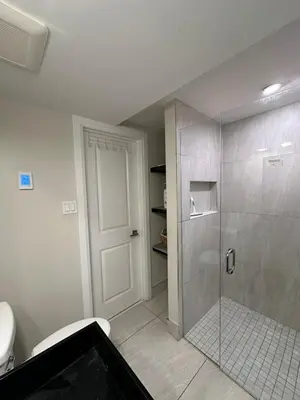 a bathroom with a shower with a glass door at Spacious 2 Bedroom & 2 Bathroom Suit Near Fairview Mall & Waterloo Airport in Kitchener