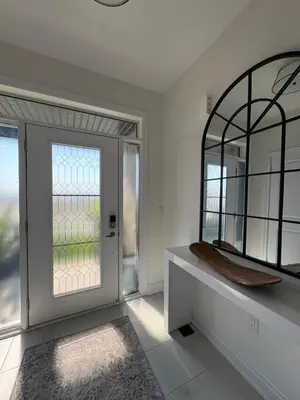 a bathroom with a mirror and a window at Season Bliss - Blue Mountain Ski & Wasaga Beach in Wasaga Beach